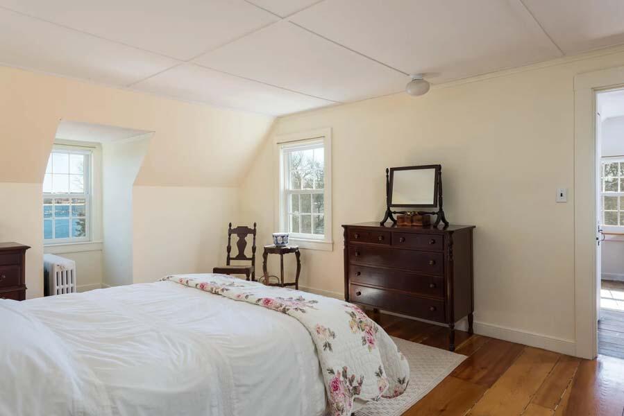 16 Jefferson Shs Road Buzzards Bay, MA 02532 - Photo 13 of 28 a bedroom with a bed and wooden floor