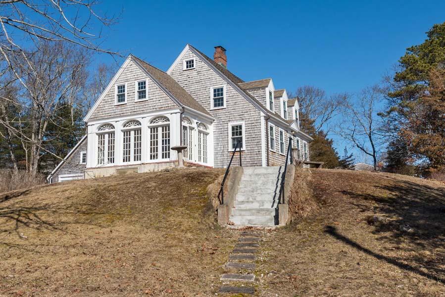 16 Jefferson Shs Road Buzzards Bay, MA 02532 - Photo 22 of 28 a front view of a house with a yard