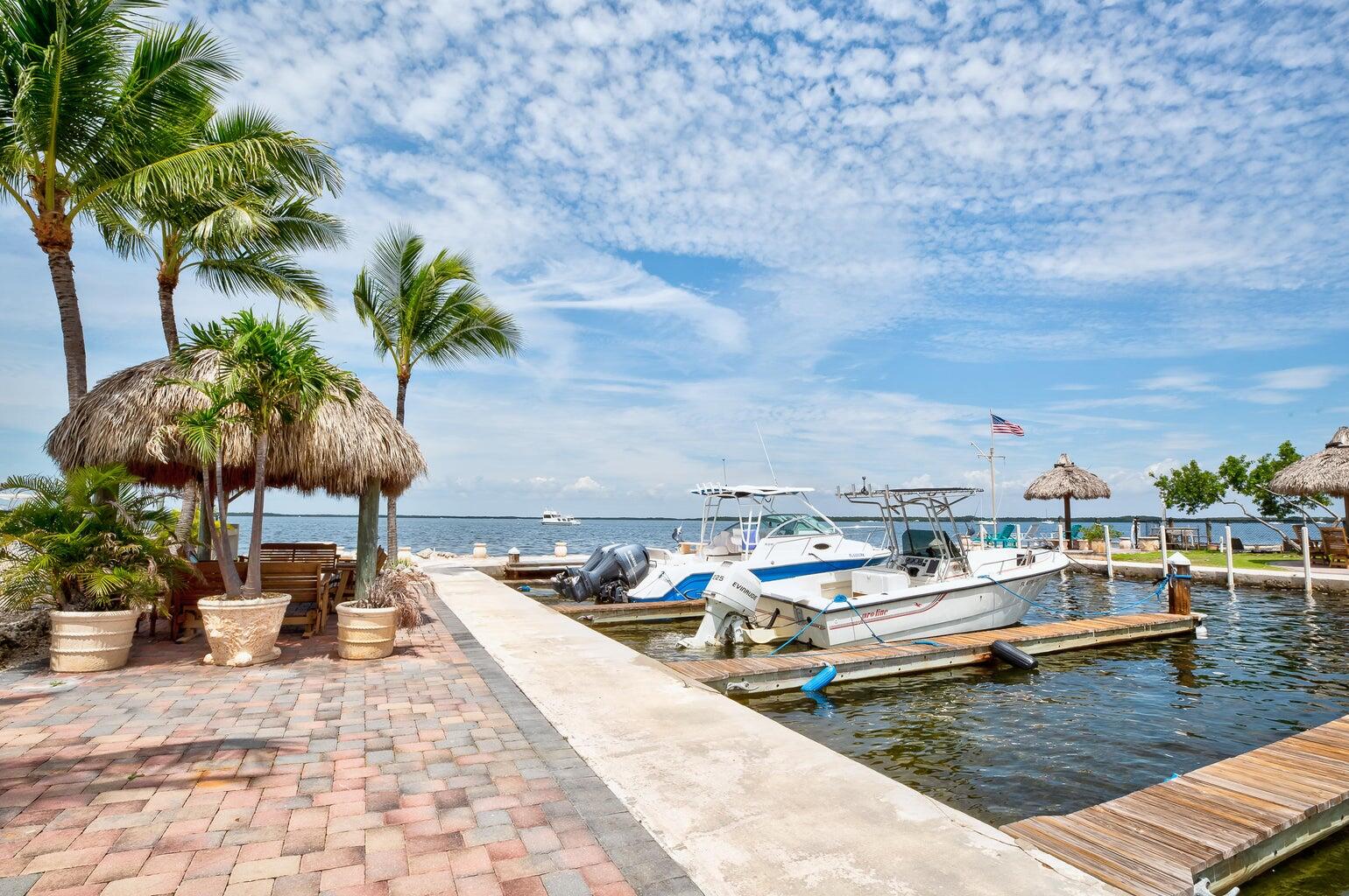 101620 Overseas Highway, Unit 5N Key Largo, FL 33037 - Photo 21 of 28 a view of swimming pool with lounge chair and lounge chair