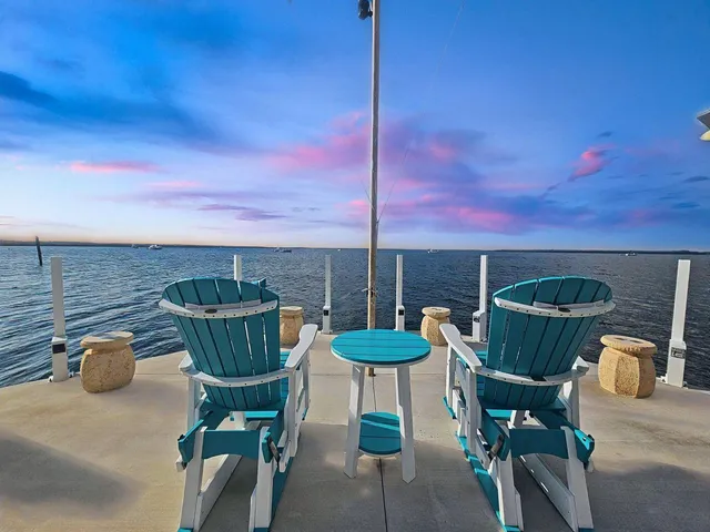 a view of a chairs and table in the patio