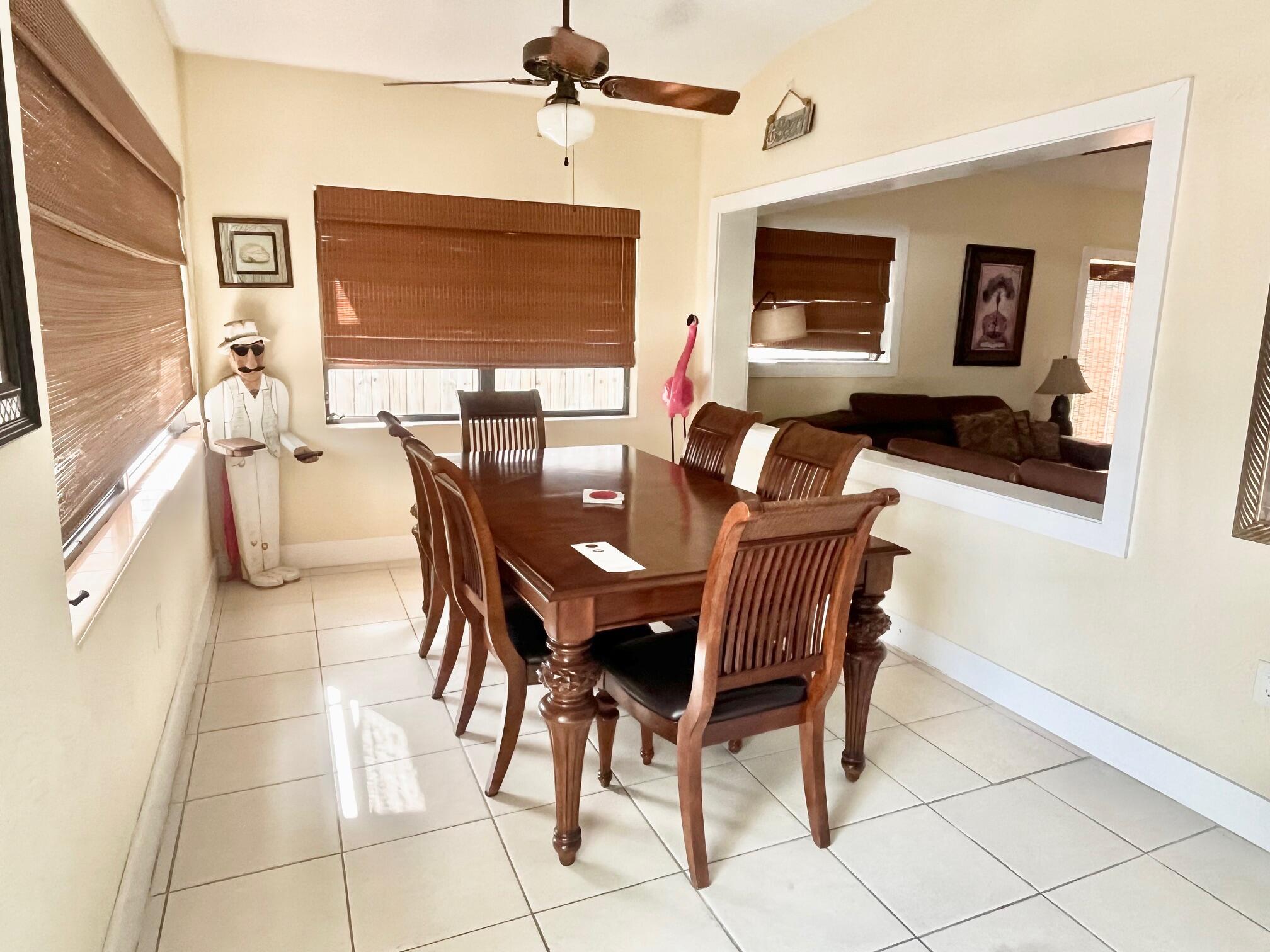 101620 Overseas Highway, Unit 5N Key Largo, FL 33037 - Photo 5 of 28 a dining room with furniture and window