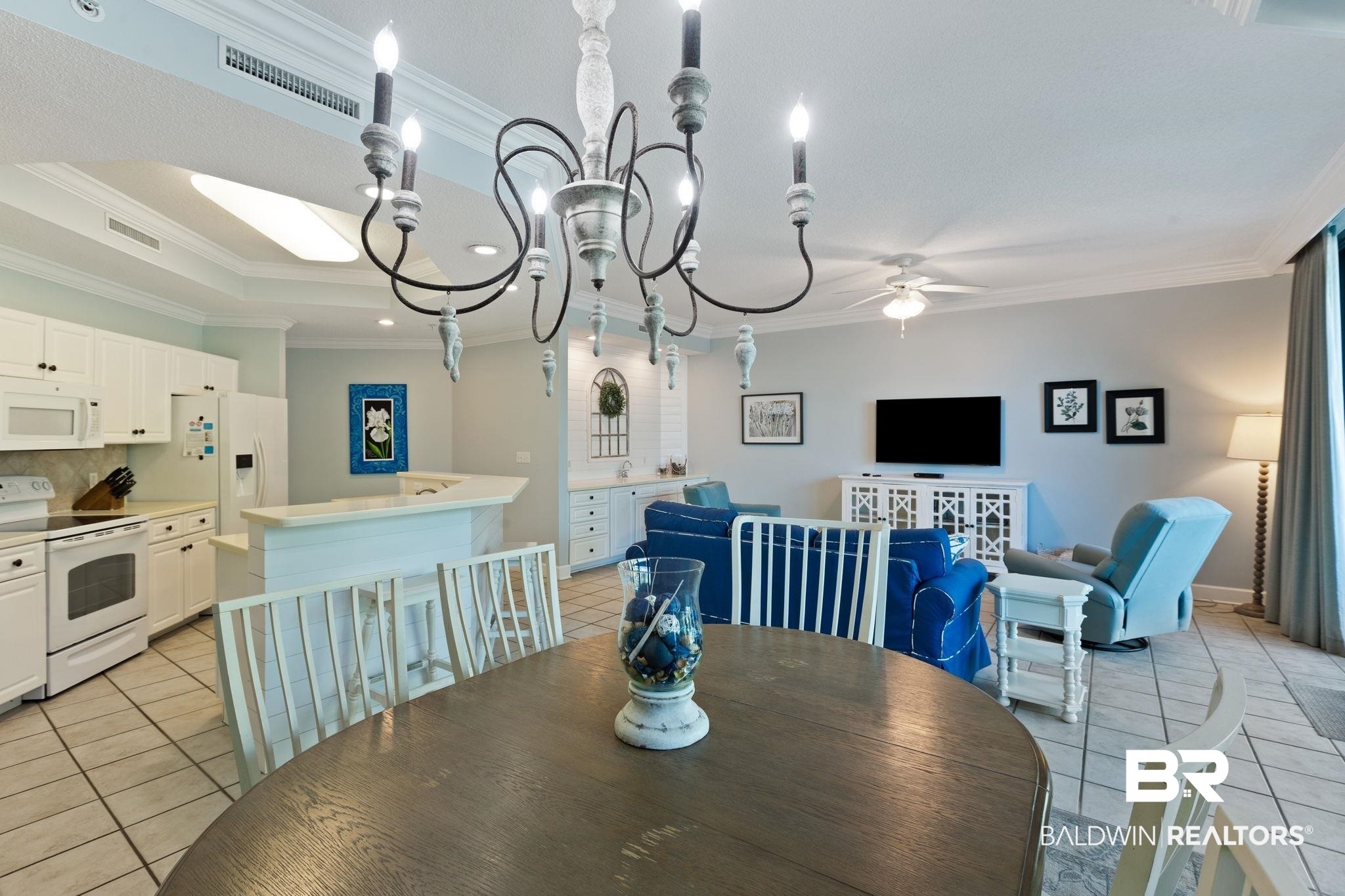 27580 Canal Road, Unit 1112 Orange Beach, AL 36561 - Photo 15 of 50 Dining space featuring light tile patterned floors, crown molding, a chandelier, a ceiling fan, and recessed lighting