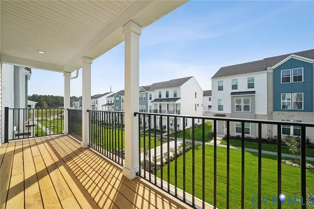 a view of a balcony with wooden floor