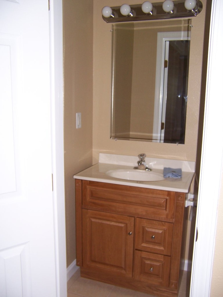 4234 Spring Park Road Jacksonville, FL 32207 - Photo 13 of 20 a bathroom with a sink and a mirror
