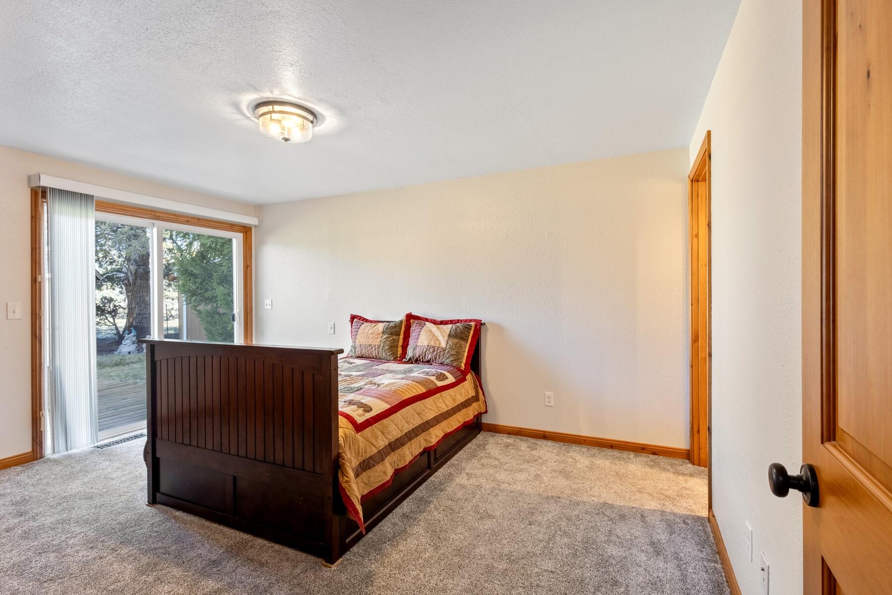 19800 Connarn Road Bend, OR 97703 - Photo 20 of 50 Bedroom with full bath and deck access