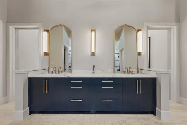 a bathroom with a sink and mirror