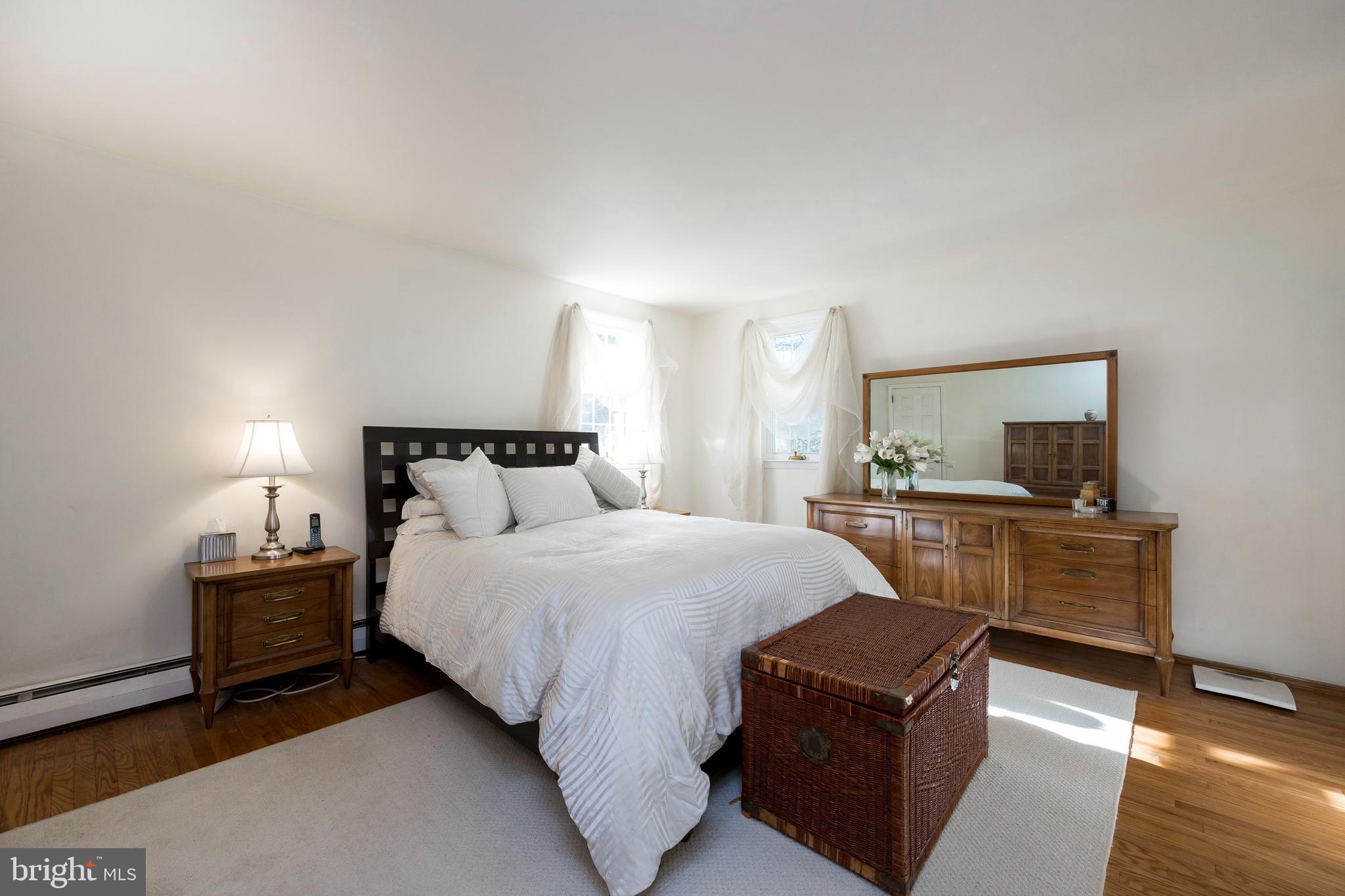 468 Rocksville Road Holland, PA 18966 - Photo 14 of 31 a bedroom with a bed and wooden floor