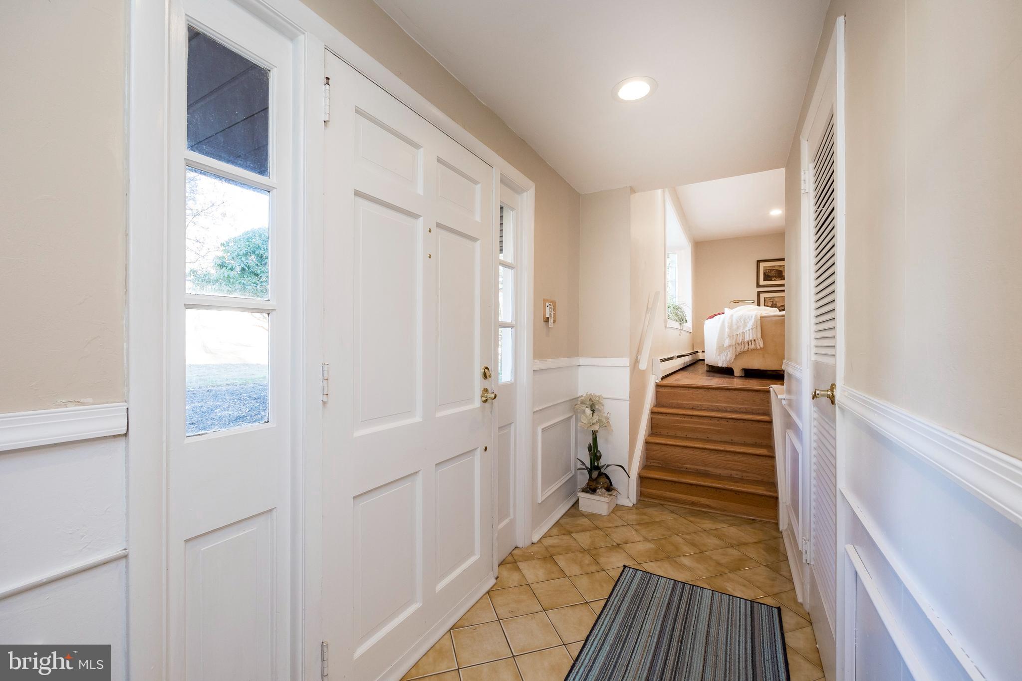 468 Rocksville Road Holland, PA 18966 - Photo 8 of 31 a view of a hallway with wooden floor and windows