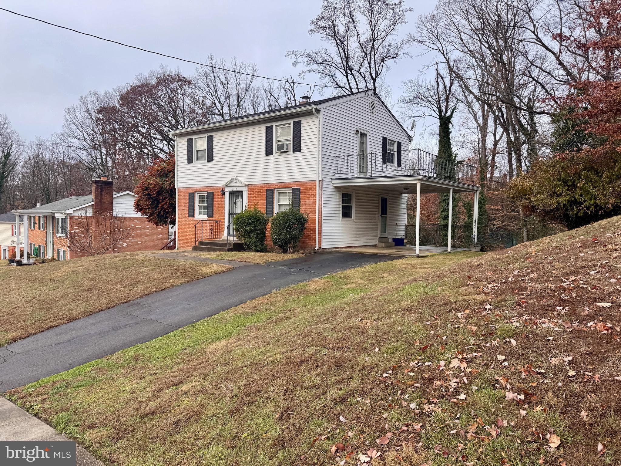 2112 Patrick Street Woodbridge, VA 22191 - Photo 18 of 65 a front view of a house with a yard