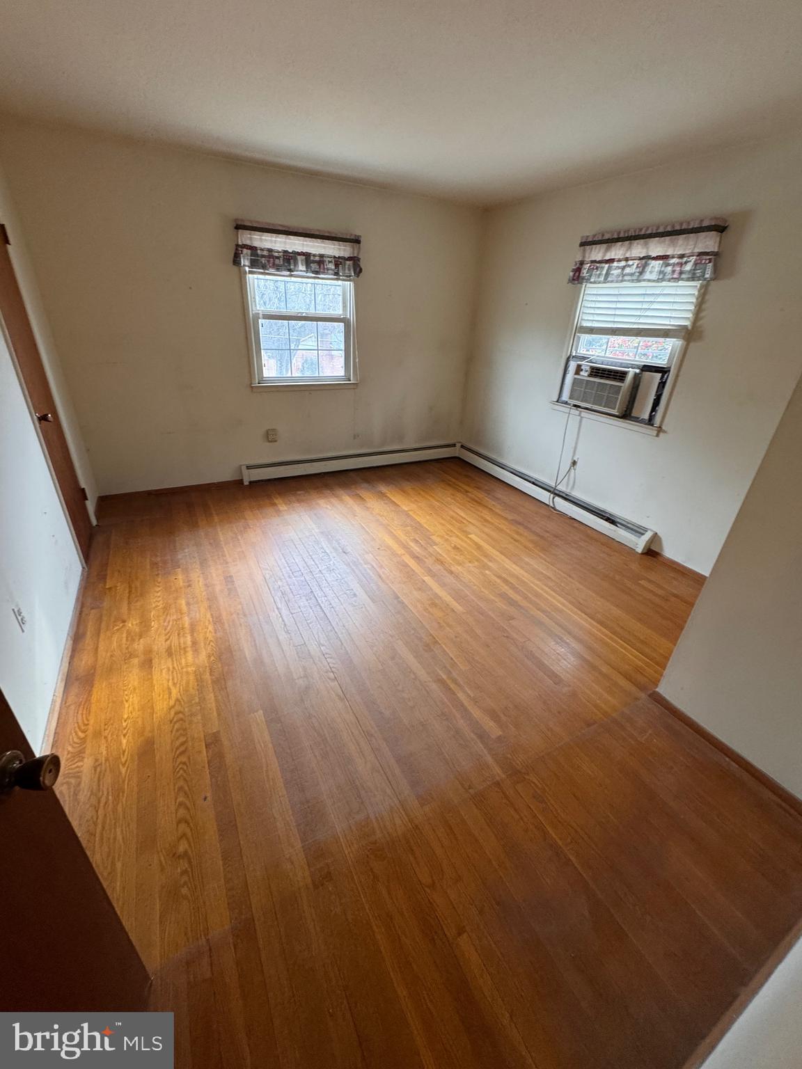 2112 Patrick Street Woodbridge, VA 22191 - Photo 54 of 65 a view of an empty room with wooden floor and a window