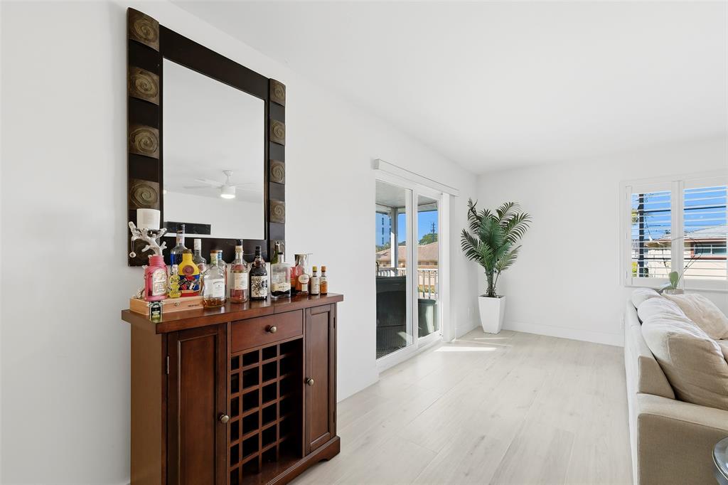 1450 North Riverside Drive, Unit 201 Pompano Beach, FL 33062 - Photo 21 of 30 a room with furniture and a fireplace