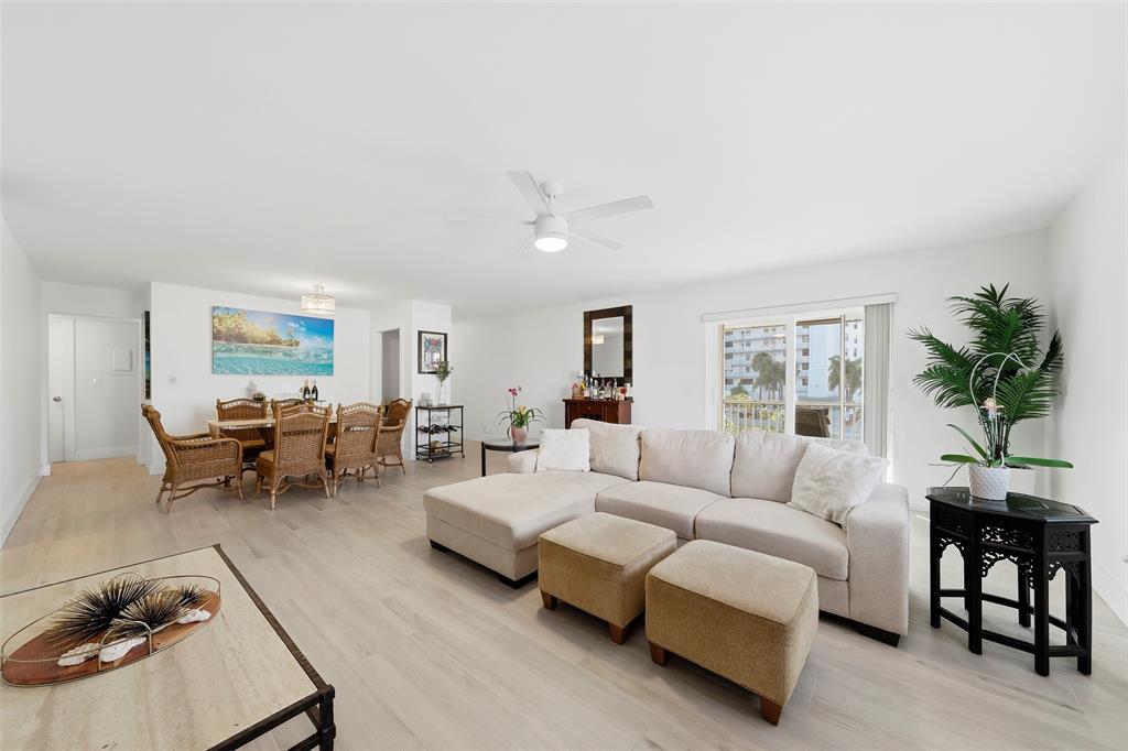 1450 North Riverside Drive, Unit 201 Pompano Beach, FL 33062 - Photo 4 of 30 a living room with furniture and a potted plant