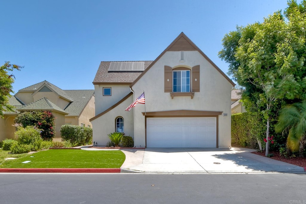538 Poets Square Fallbrook, CA 92028 - Photo 1 of 1 a front view of a house with a yard and garage