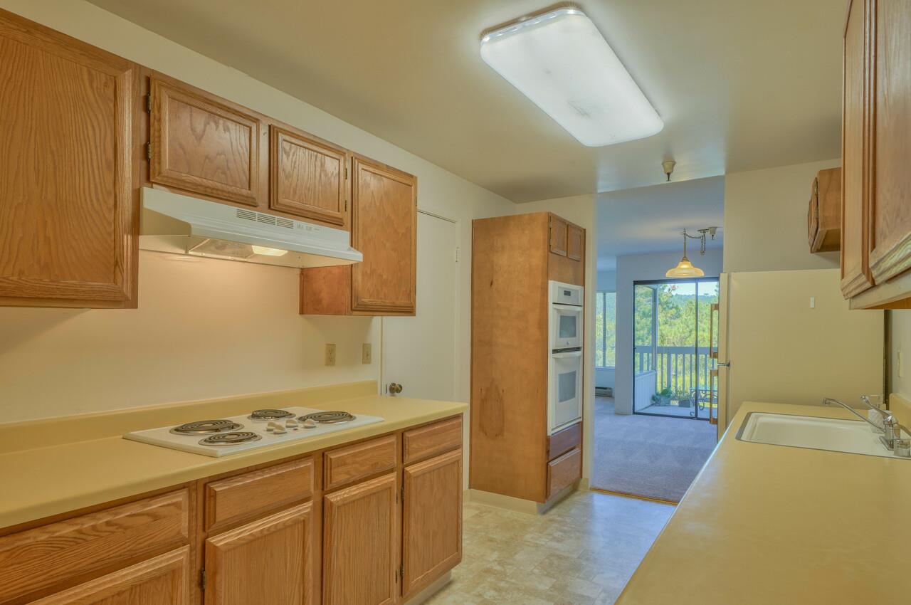18 Shepherds Knoll Road Monterey, CA 93940 - Photo 13 of 28 a kitchen with a stove a refrigerator and a sink
