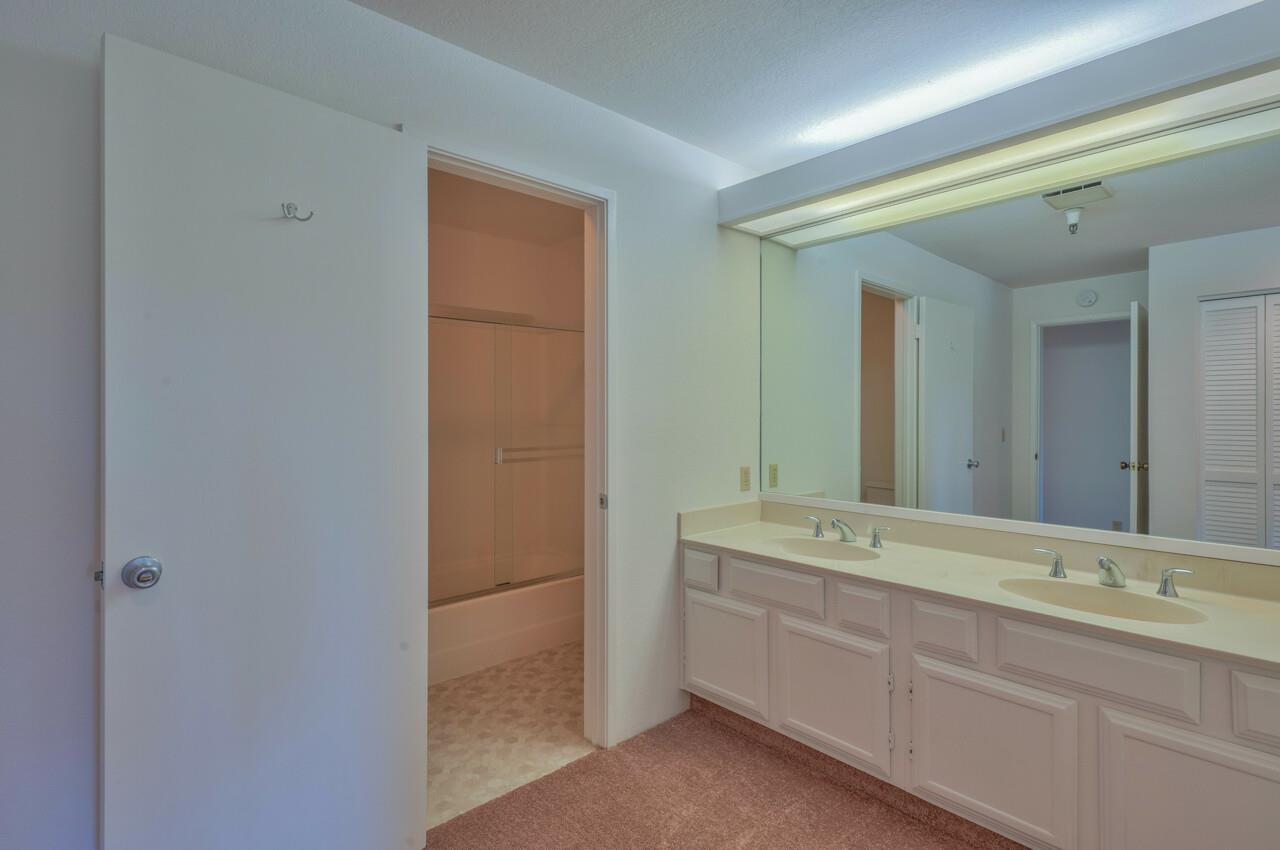 18 Shepherds Knoll Road Monterey, CA 93940 - Photo 19 of 28 a spacious bathroom with a double vanity sink and mirror