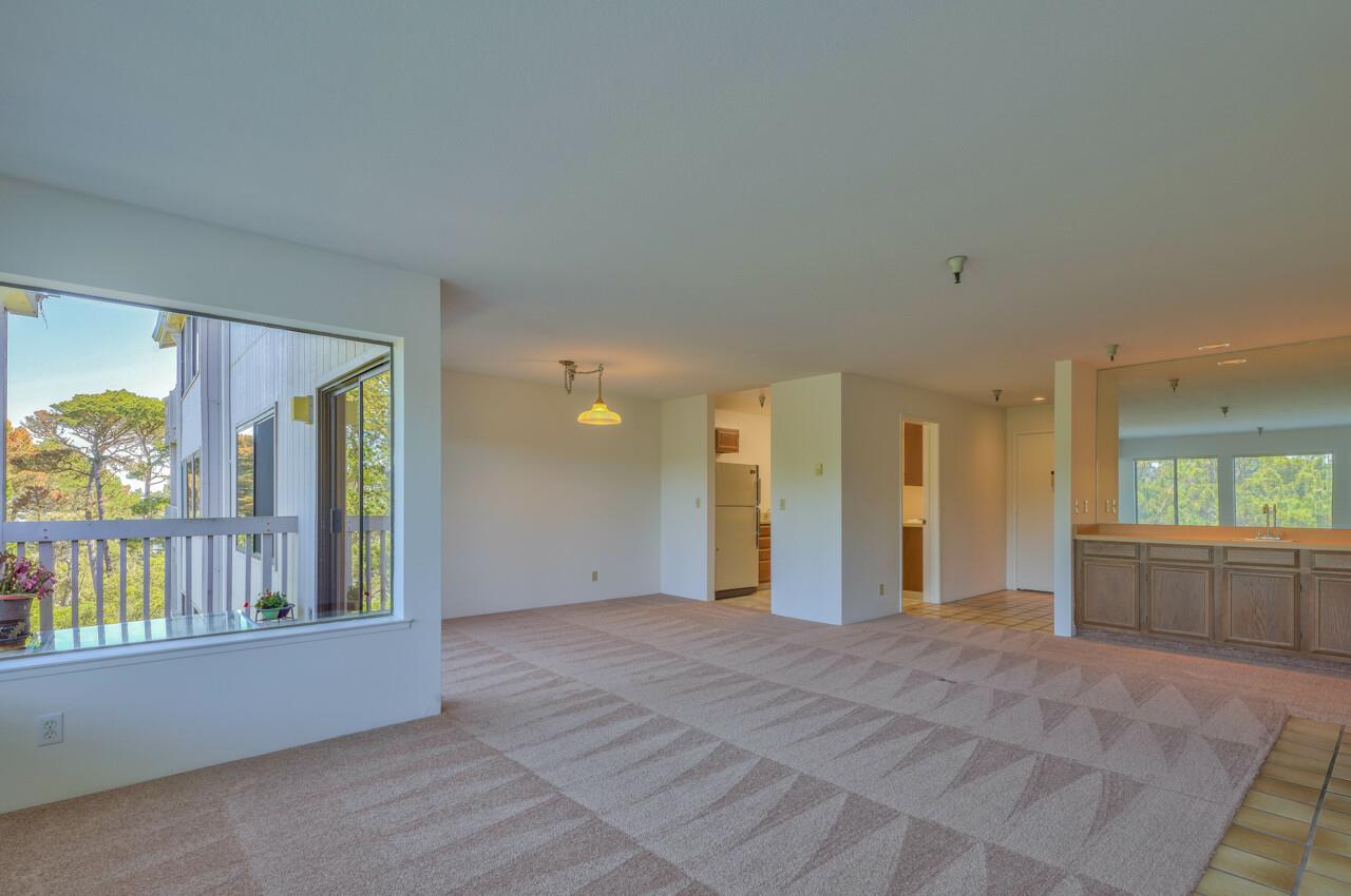 18 Shepherds Knoll Road Monterey, CA 93940 - Photo 6 of 28 an empty room with windows and painted walls