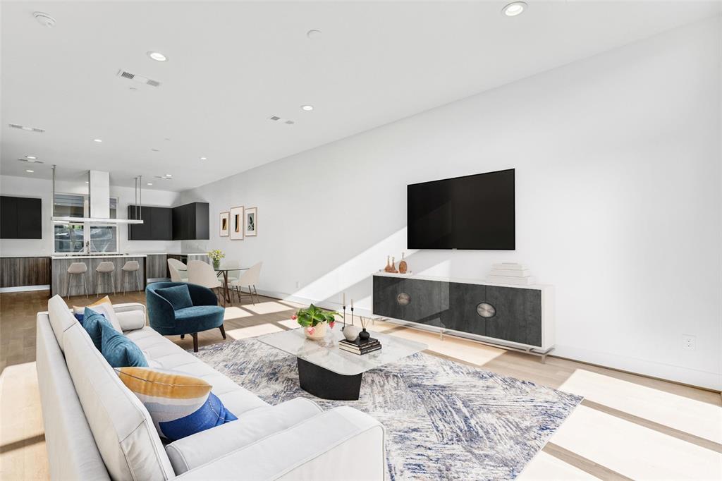 3040 ChImes Street Dallas, TX 75219 - Photo 1 of 38 a living room with furniture and a flat screen tv