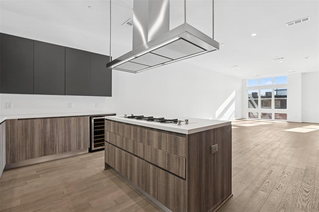 3040 ChImes Street Dallas, TX 75219 - Photo 13 of 38 a kitchen with stainless steel appliances a stove and a refrigerator