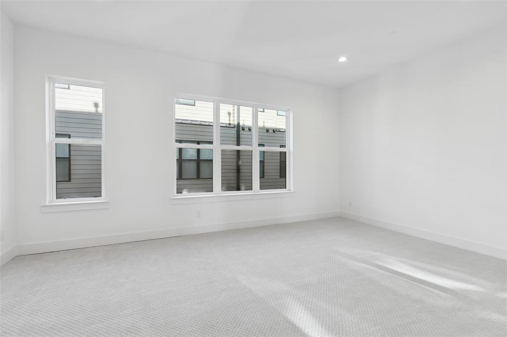 3040 ChImes Street Dallas, TX 75219 - Photo 16 of 38 a view of an empty room with a window
