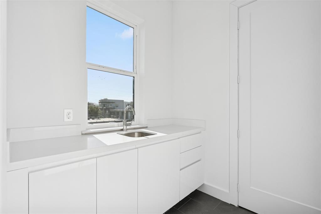 3040 ChImes Street Dallas, TX 75219 - Photo 22 of 38 a utility room with dryer and washer