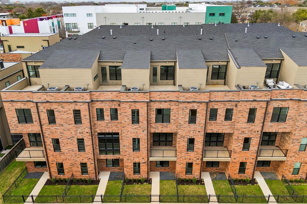 3040 ChImes Street Dallas, TX 75219 - Photo 34 of 38 a aerial view of a brick building next to a yard