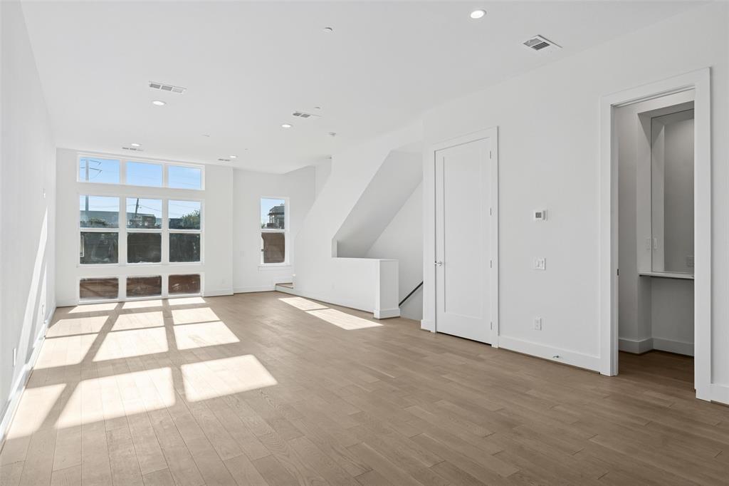 3040 ChImes Street Dallas, TX 75219 - Photo 6 of 38 a view of an empty room with a window