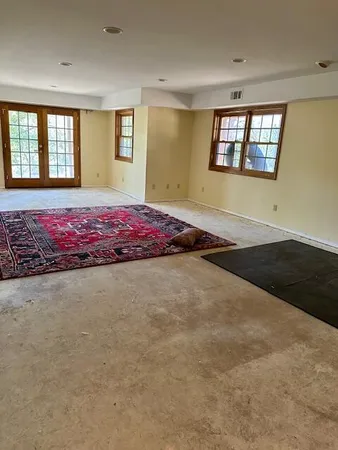 an empty room with a bench