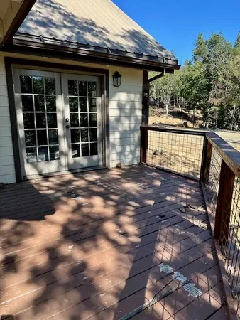 a view of balcony with wooden floor