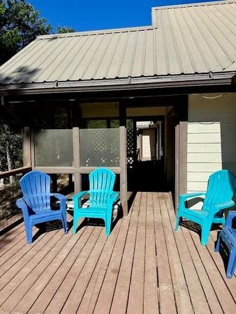 a view of balcony with wooden floor and outdoor seating