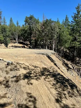 a view of a lake with a yard