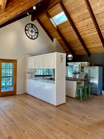 a kitchen with a table and chairs in it