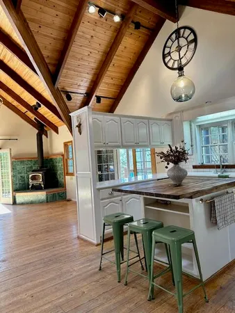 a kitchen with a table and chairs in it