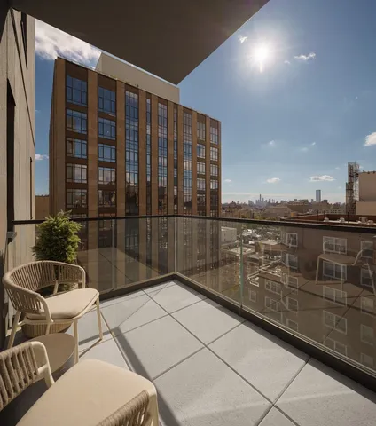 a view of balcony with furniture