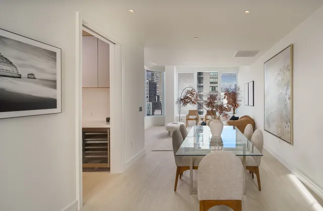 a view of dining room with furniture and wooden floor