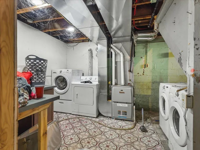 a view of a storage room with water heater and racks