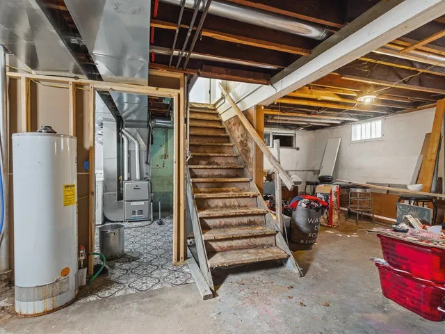 an entryway with a flower pot and windows