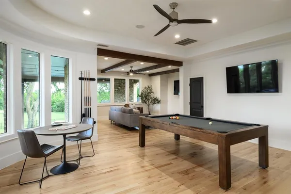 a bedroom with a large bed and a large window