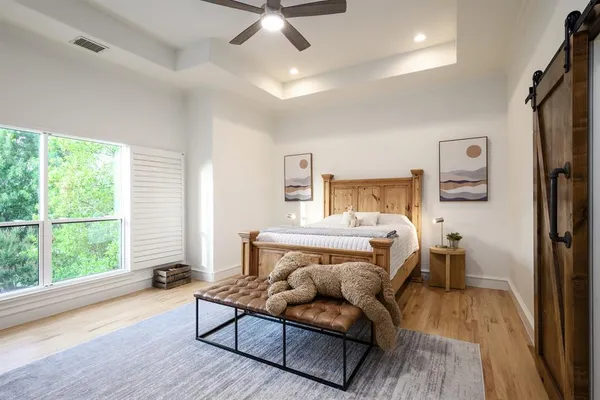 a bedroom with a bed and a window