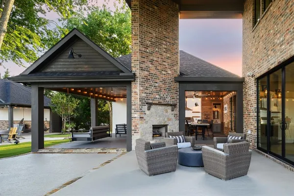 a view of a house with a yard porch and sitting area