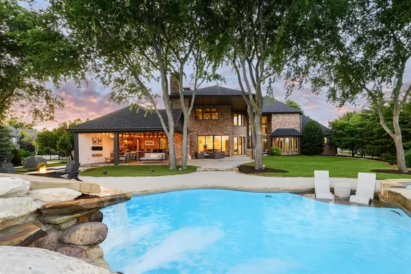 a front view of a house with a yard table and chairs