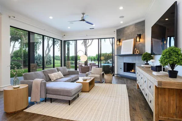 a living room with furniture and wooden floor