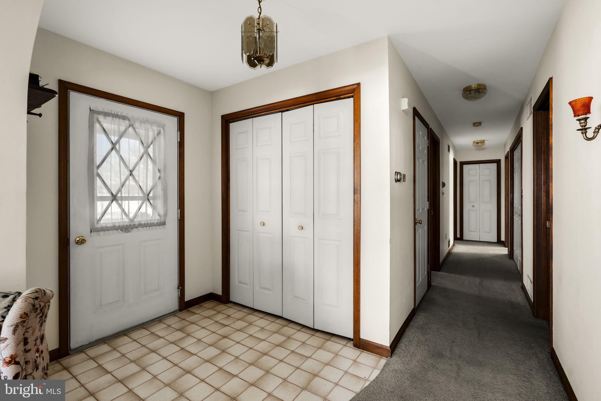 85 Wissler Road Lititz, PA 17543 - Photo 19 of 58 a view of a hallway with wooden floor and a bathroom