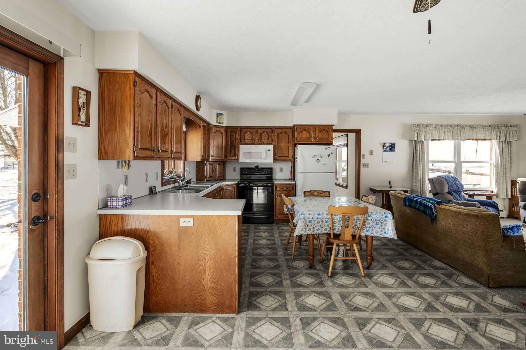 85 Wissler Road Lititz, PA 17543 - Photo 24 of 58 a living room with furniture a large window and kitchen view