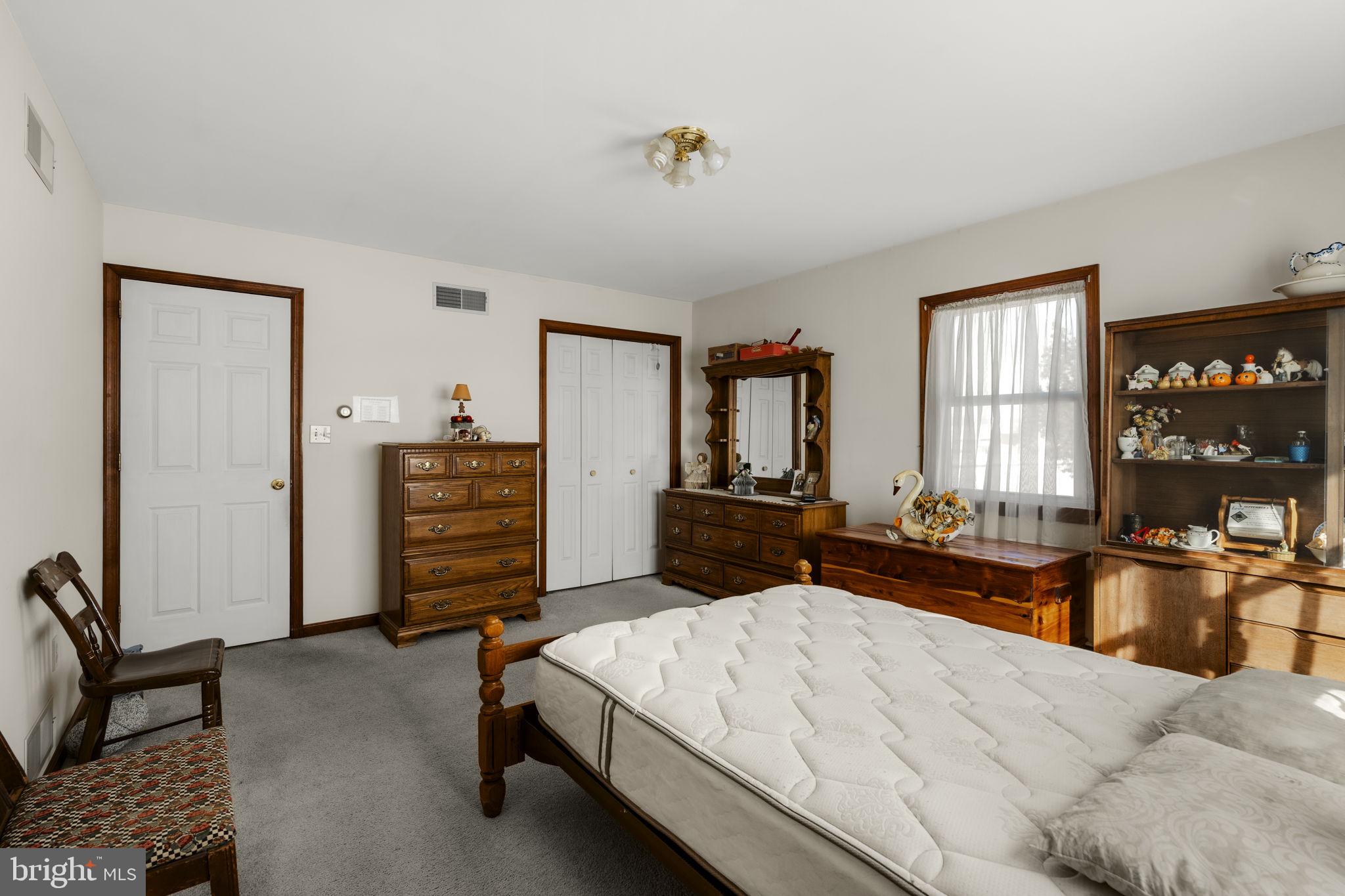 85 Wissler Road Lititz, PA 17543 - Photo 34 of 58 a bedroom with furniture and a window