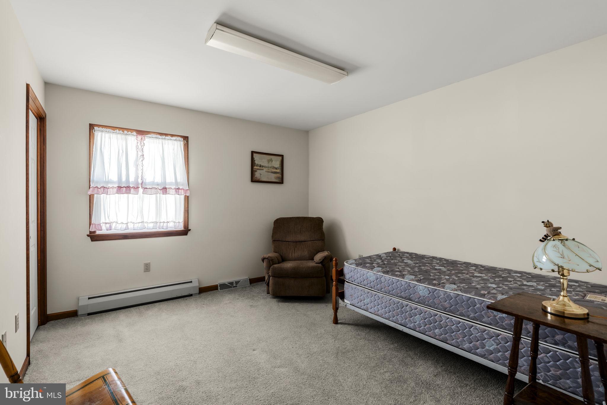 85 Wissler Road Lititz, PA 17543 - Photo 39 of 58 a living room with furniture and a window