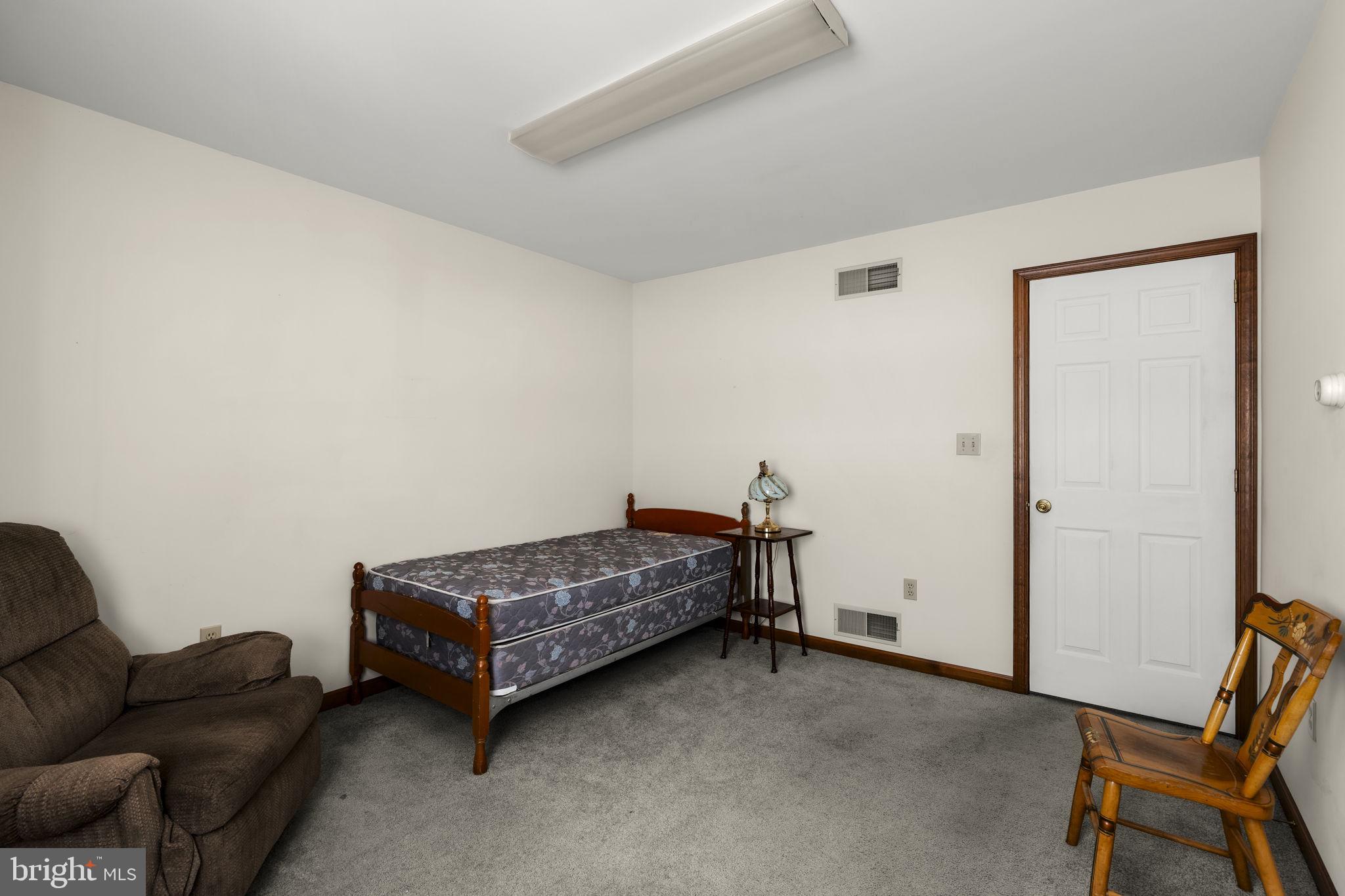 85 Wissler Road Lititz, PA 17543 - Photo 40 of 58 a room with a couch and a chair