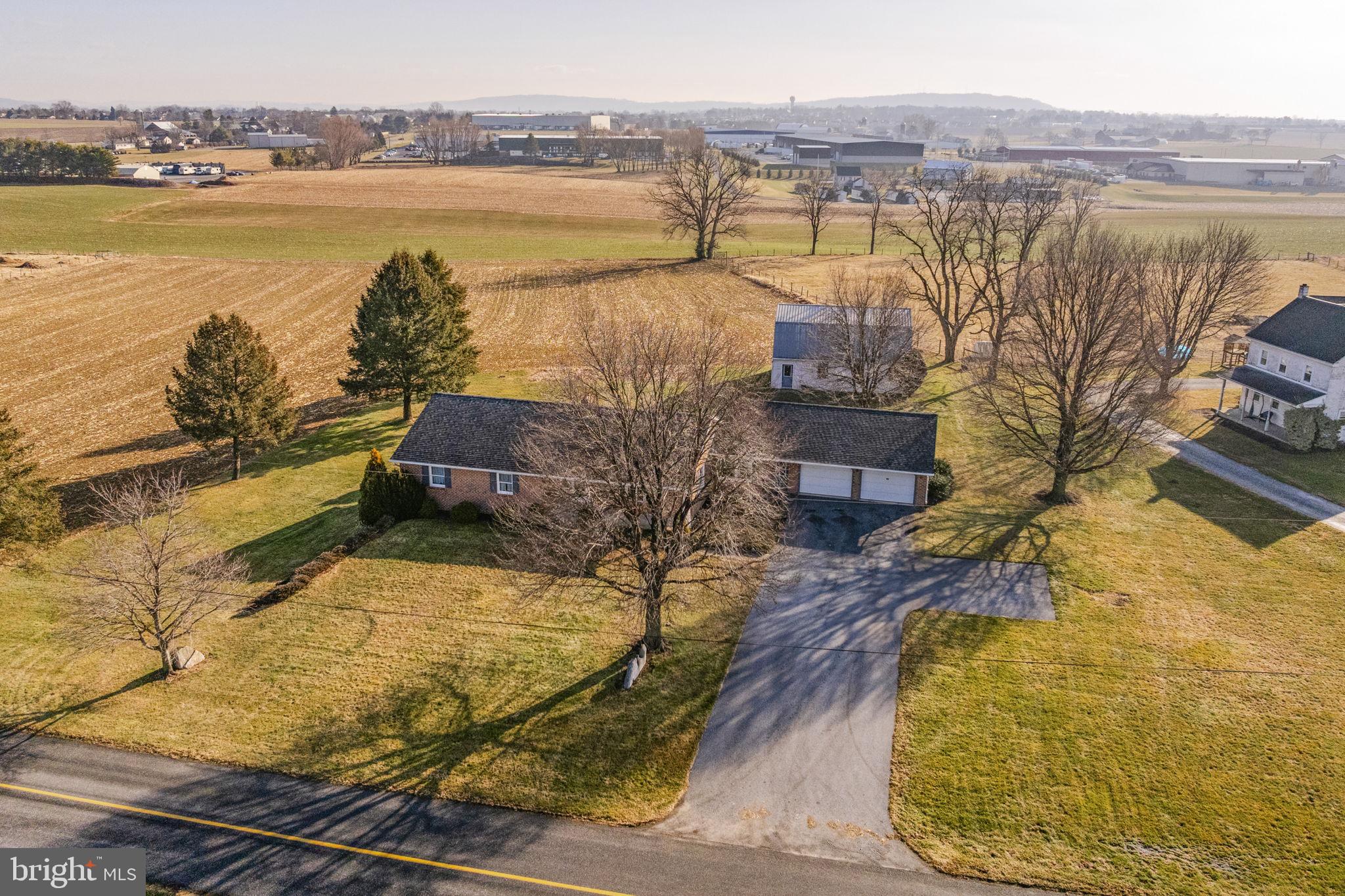 85 Wissler Road Lititz, PA 17543 - Photo 4 of 58 a view of a swimming pool with a table and chairs