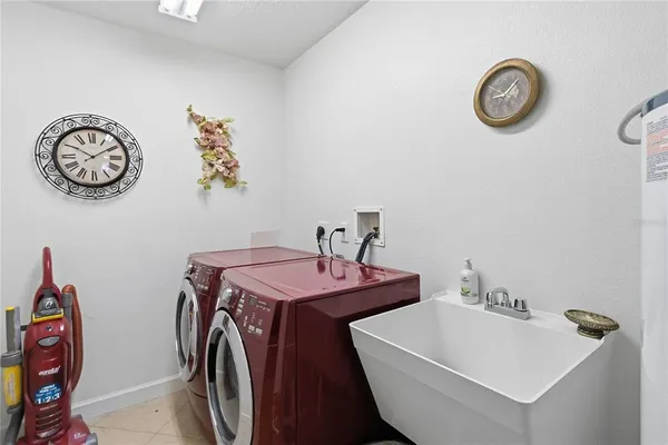 a bathroom with a granite countertop sink a toilet a mirror and shower