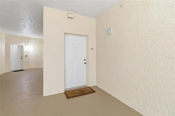 a view of a room with a table and a chair