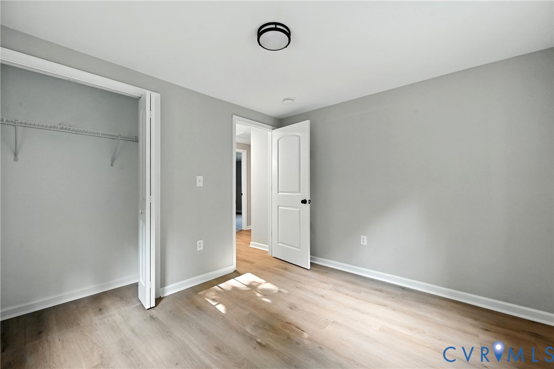 24611 Williamson Road Dinwiddie, VA 23841 - Photo 24 of 34 Unfurnished bedroom featuring wood finished floors